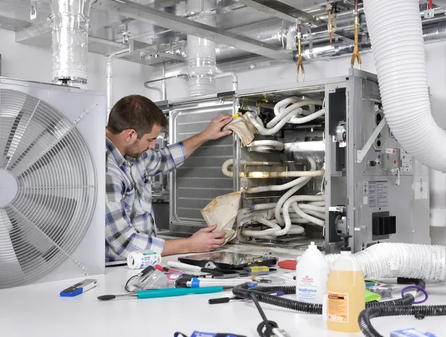 Wayland Air Duct Cleaning specialist performing precision AC coil cleaning in Wayland