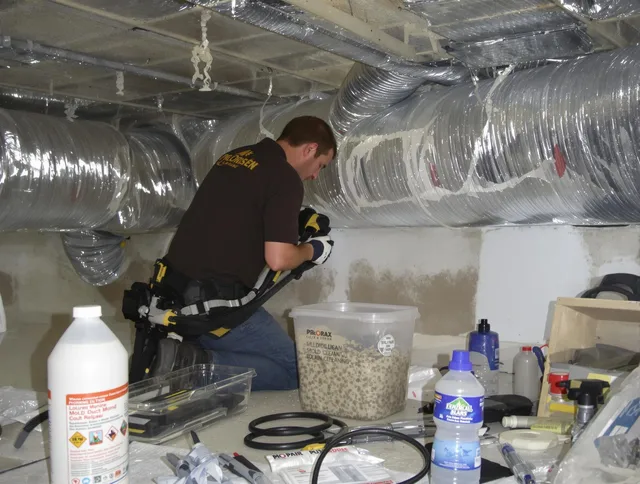 Wayland Air Duct Cleaning specialist performing professional mold removal from air ducts in Wayland